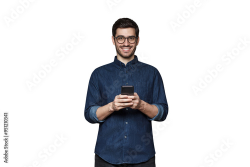 Smiiling modern businessman in denim shirt and trendy glasses holding his phone with both hands