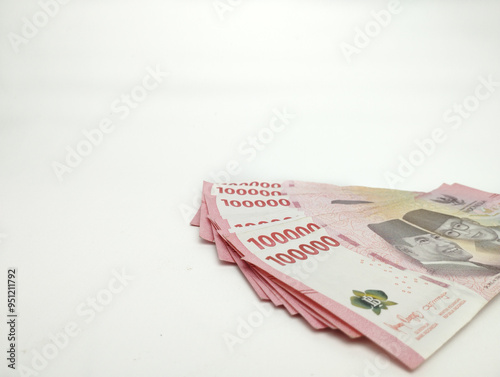 Close up One Hundred thousand Indonesian banknotes (Rupiah). Cash payment concept. Indonesian rupiah currency (Rp. 100,000 One Hundred Thousand Rupiah) on a white background