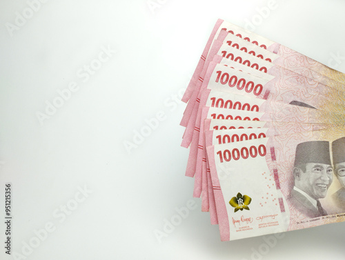 Close up One Hundred thousand Indonesian banknotes (Rupiah). Cash payment concept. Indonesian rupiah currency (Rp. 100,000 One Hundred Thousand Rupiah) on a white background