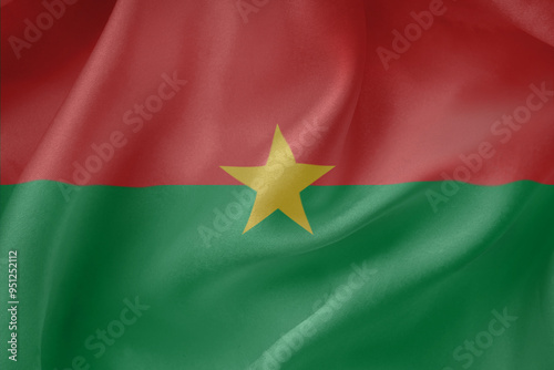  Burkina Faso waving flag close up fabric texture background