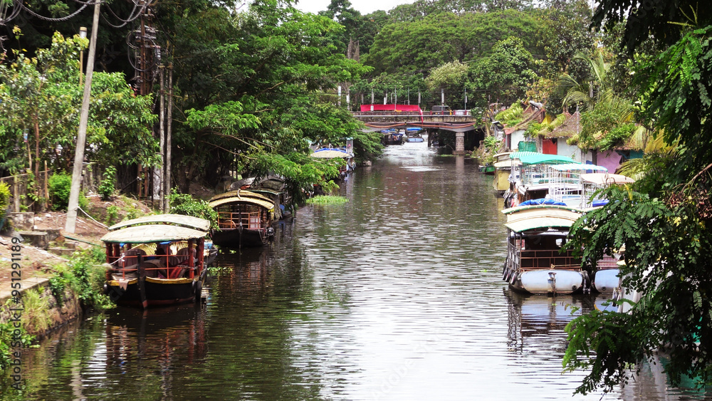 Shikara tourist boats parked in the canal at Alappuzha, Kerala, India Shikara tourist boats parked in the canal at Alappuzha, Kerala, India
