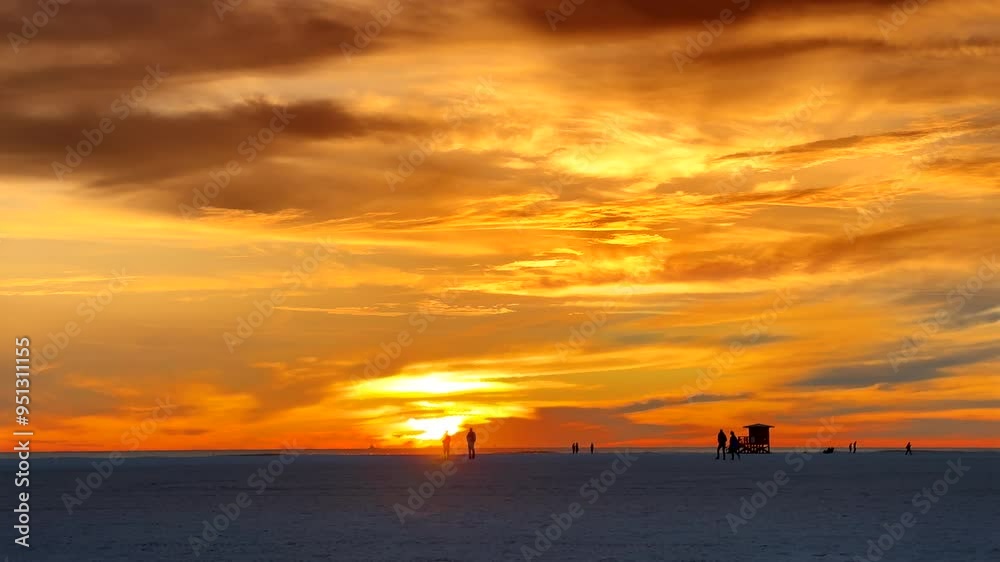 People enjoy tropical beach vacation during sunset in SiestaKey, Sarasota, Florida People enjoy tropical beach vacation during sunset in SiestaKey, Sarasota, Florida