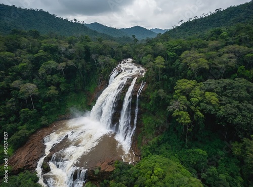 View from above of a waterfall in the lush, green tropical jungle that envelops Doi Inthanon National Park in Chiang Mai, Thailand. This natural location emphasises water sustainability in addition to photo