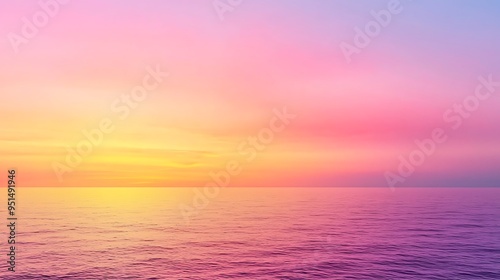 Pink and yellow hues dance over ocean waves, creating a serene and captivating sunset scene.