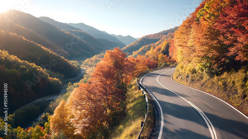 Aerial view of a winding mountain road during autumn