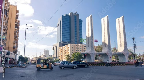 Karachi Pakistan 2022, 4k Time-lapse of cityscape and landmarks of karachi city at Teen Talwar and HBL Head Office early morning with people and traffic photo