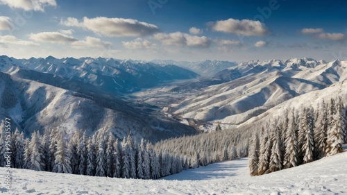Panoramic snowy mountain to winter valley