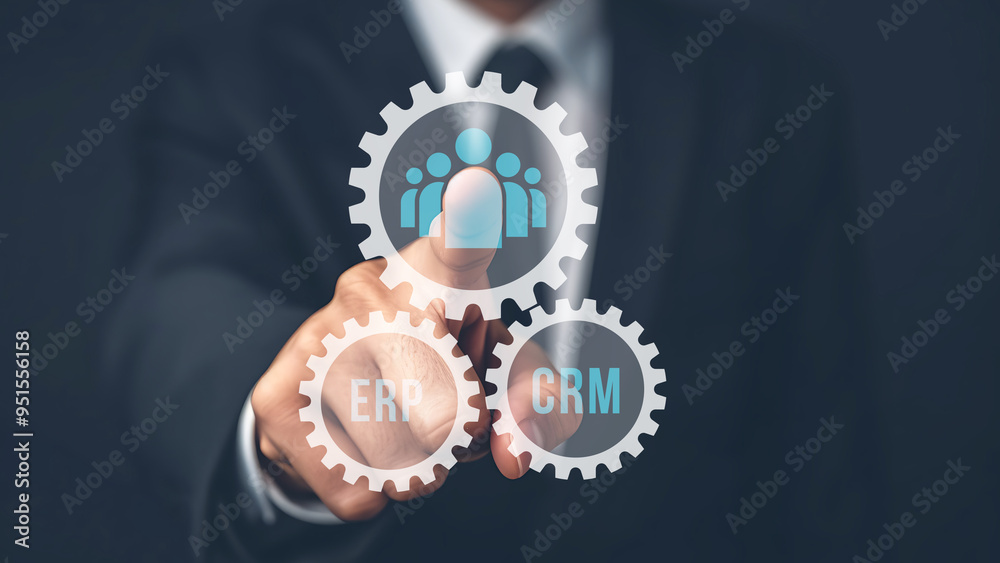 Businessman show CRM and ERP symbol to support business database analysis. Businessman show CRM and ERP symbol to support business database analysis.
