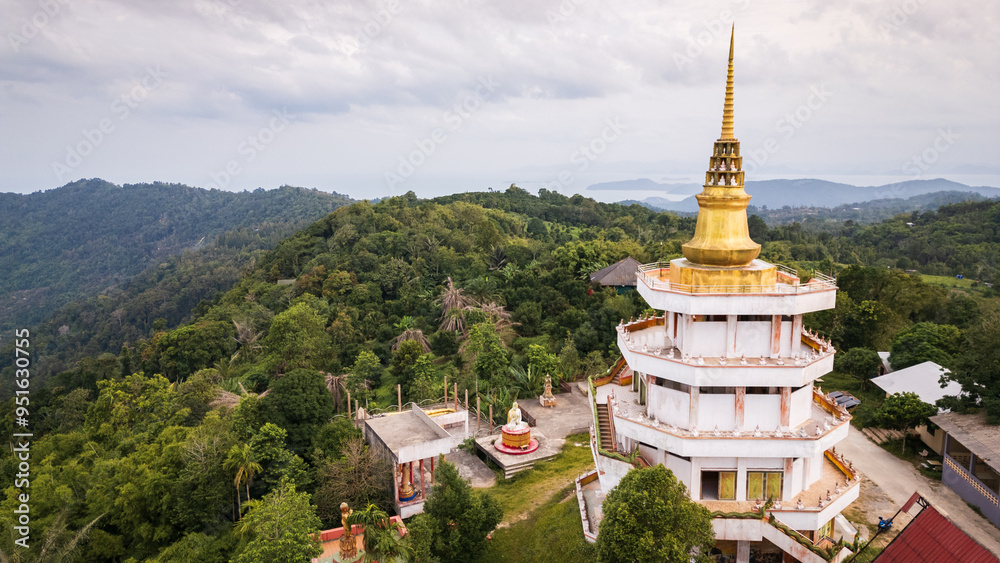 Fototapeta premium Aerial of Koh Samui island Thailand buddhist temple pagoda in top of the rainforest jungle hill near Lamai beach village 