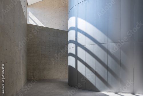 Abstract, minimalist, modern architectural space with concrete walls and curved element