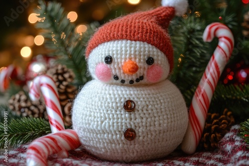 Sweet little snowman with rosy cheeks and a carrot nose, surrounded by candy canes photo