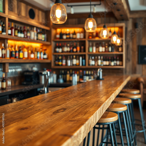 Wooden bar counter with warm lighting and bottles on shelves