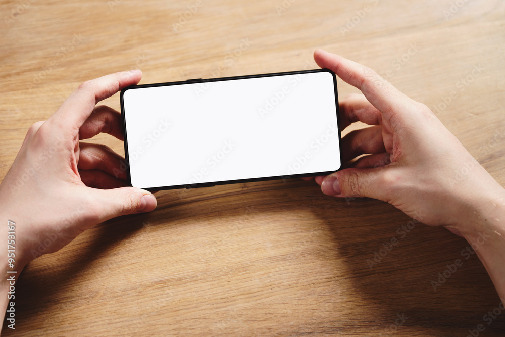young man hands holding smartphone with blank white screen young man hands holding smartphone with blank white screen