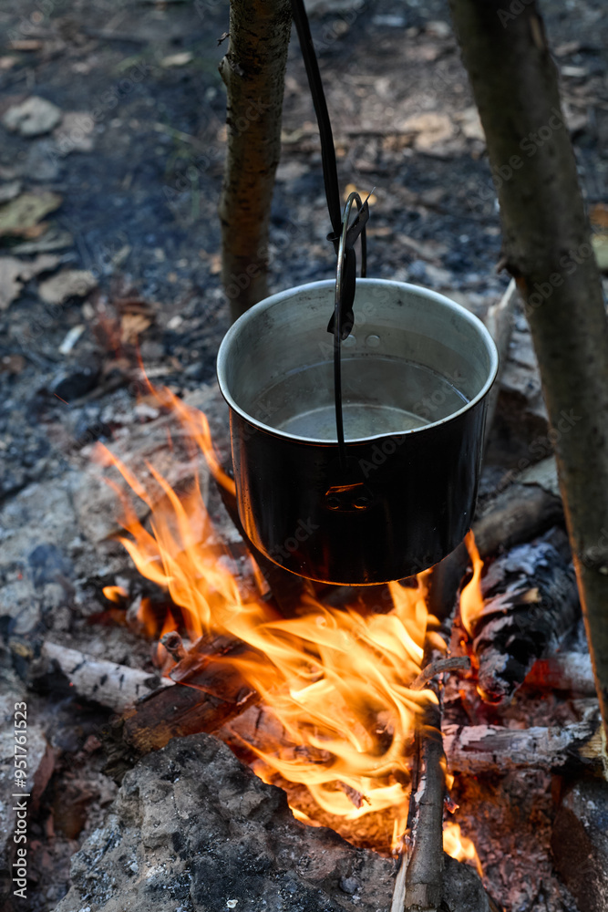 cooking on an open fire in a camp in nature
cooking on an open fire in a camp in nature