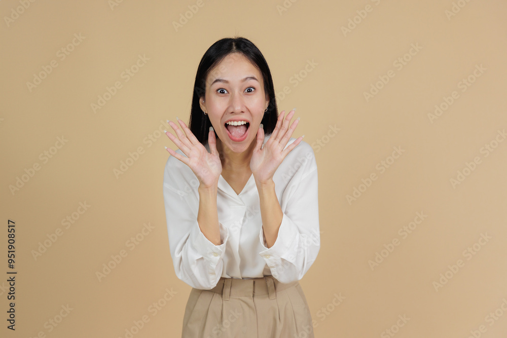 Excited Woman with Hands on Face, Beige Background Excited Woman with Hands on Face, Beige Background