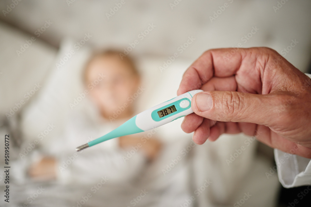 Parent, hand and reading thermometer for sick child in bed to monitor temperature for fever or covid infection. Person, kid and checking for cold, illness or flu in home for closeup or mpox symptoms Parent, hand and reading thermometer for sick child in bed to monitor temperature for fever or covid infection. Person, kid and checking for cold, illness or flu in home for closeup or mpox symptoms
