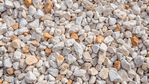 Crushed limestone texture with white and light brown stones in a natural arrangement