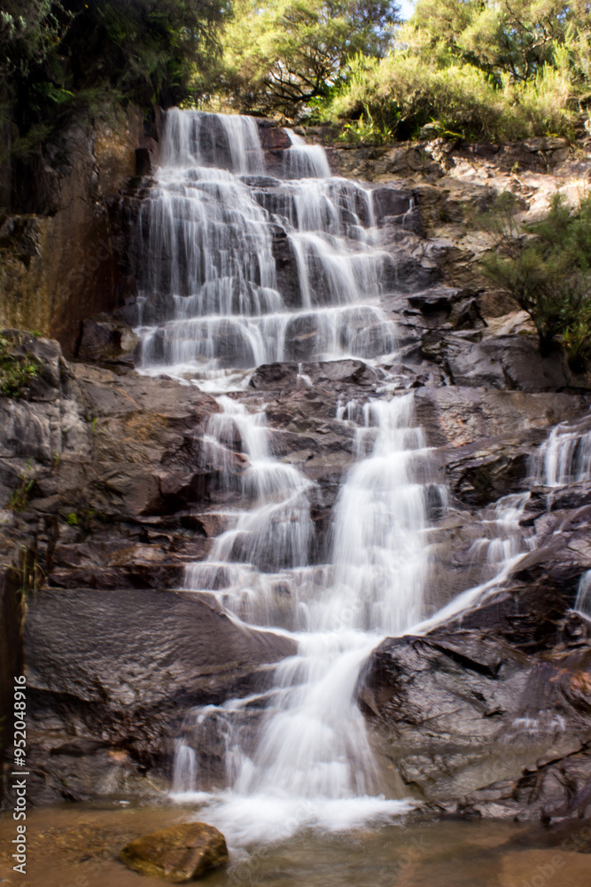 Waterfall, flowing down a steep cliff in cascades in a stream in Magoebaskloof in South Africa. Waterfall, flowing down a steep cliff in cascades in a stream in Magoebaskloof in South Africa.