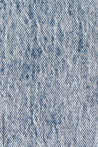 Close-up of stonewashed denim fabric. Denim, textured background image.