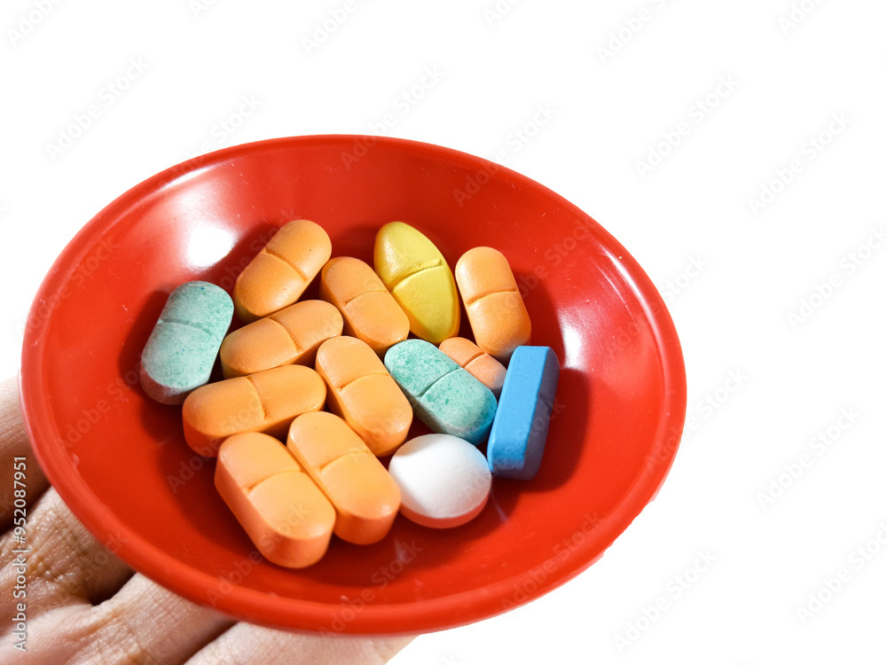 Medical drugs or narcotics or illegal substances are collected in one container and held in hand, concept of treatment and health care, isolated on white background and shot from close up. Medical drugs or narcotics or illegal substances are collected in one container and held in hand, concept of treatment and health care, isolated on white background and shot from close up.