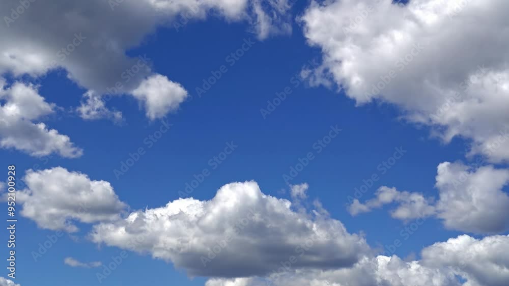Timelapse of cumulus soft white clouds moves in the blue sky background. Timelapse of cumulus soft white clouds moves in the blue sky background.