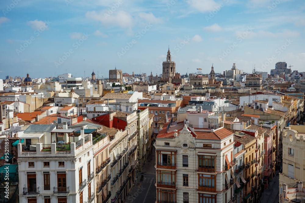 Naklejka premium A picturesque view of Valencia rooftops and tower Micalet, Spain