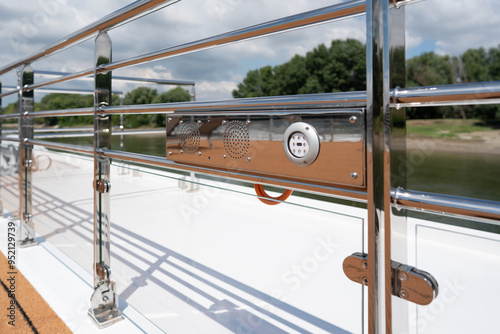 Stainless steel railings with speakers on river cruise boat deck