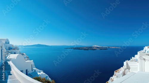 The panoramic view of Santorini white washed buildings overlooking the deep blue Aegean Sea, Greece