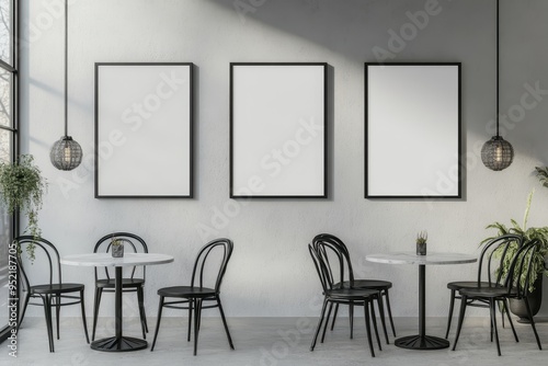 A minimalist cafe interior featuring empty frames and simple furniture.