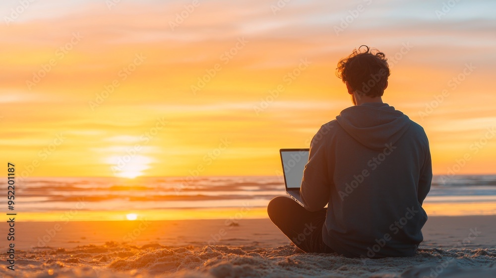 A person working on a laptop by the beach at sunset, capturing a peaceful moment of productivity and nature's beauty. A person working on a laptop by the beach at sunset, capturing a peaceful moment of productivity and nature's beauty.