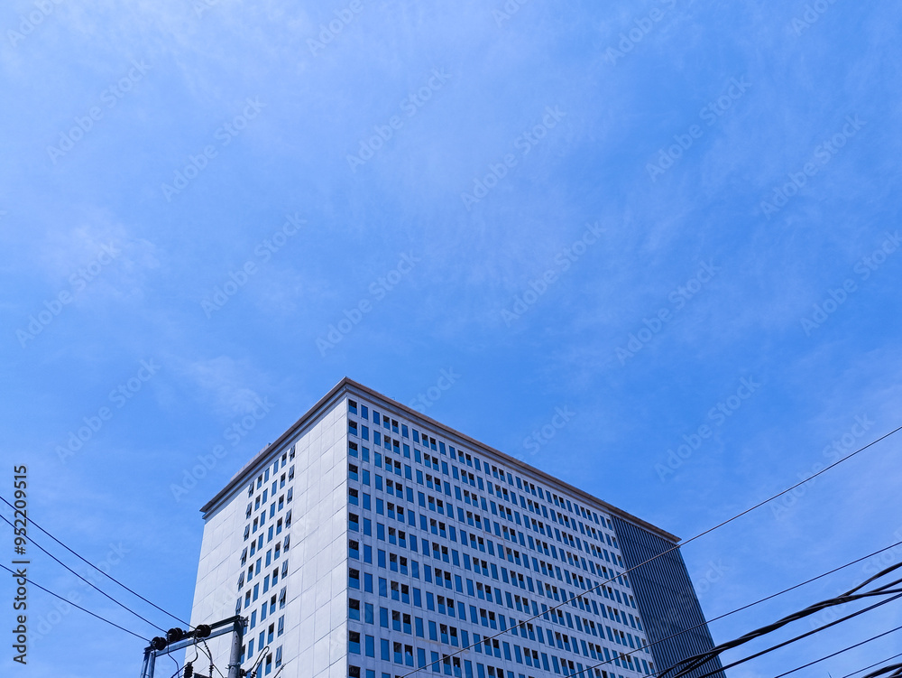 New modern block of flats in residential apartment with flat buildings exterior. Part of City Real estate property and concept. blue sky background. New modern block of flats in residential apartment with flat buildings exterior. Part of City Real estate property and concept. blue sky background.