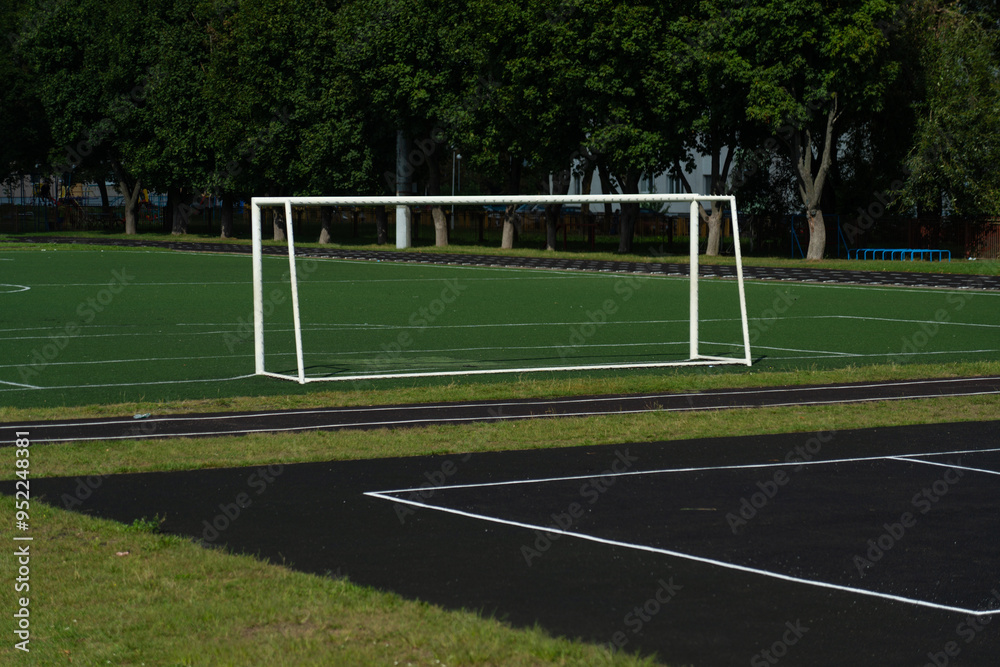 Obraz premium The school stadium. Football goal. The football field is far away