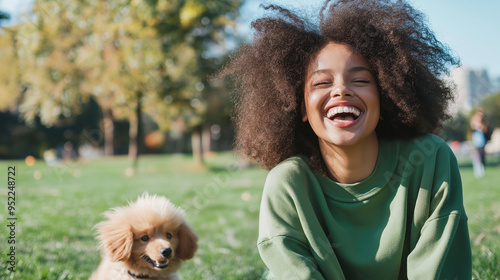 A young woman in a vibrant urban park, laughing as she plays with a dog or child, embodying her joy and strength in the face of adversity. photo