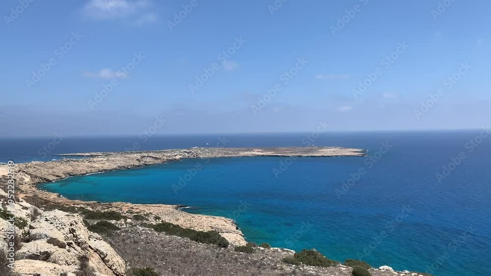Agia Napa lighthouse. Camera panning over the turquoise sea Agia Napa lighthouse. Camera panning over the turquoise sea