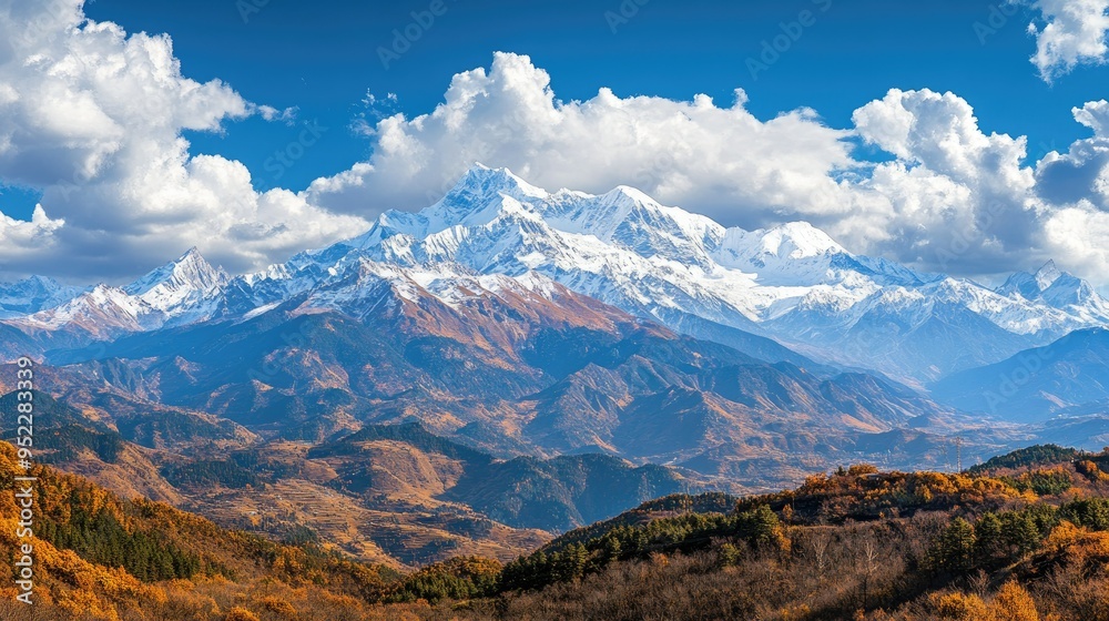 A panoramic view of a Chinese mountain range with snow-capped peaks. No people, copy space. A panoramic view of a Chinese mountain range with snow-capped peaks. No people, copy space.