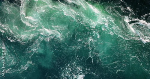 Blue waves of water of the river and the sea meet each other during high tide and low tide.