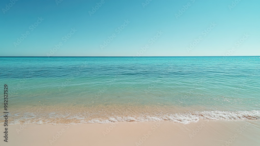 A calm, turquoise sea under a clear blue sky with gentle waves lapping at the sandy shore, peaceful coastal scene. A calm, turquoise sea under a clear blue sky with gentle waves lapping at the sandy shore, peaceful coastal scene.