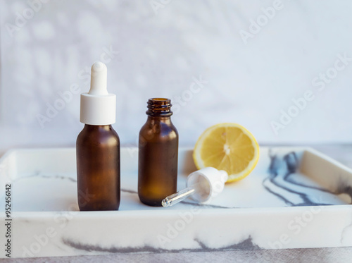 Amber Glass bottle with vitamin C . Vitamin C serum with lemon fruit