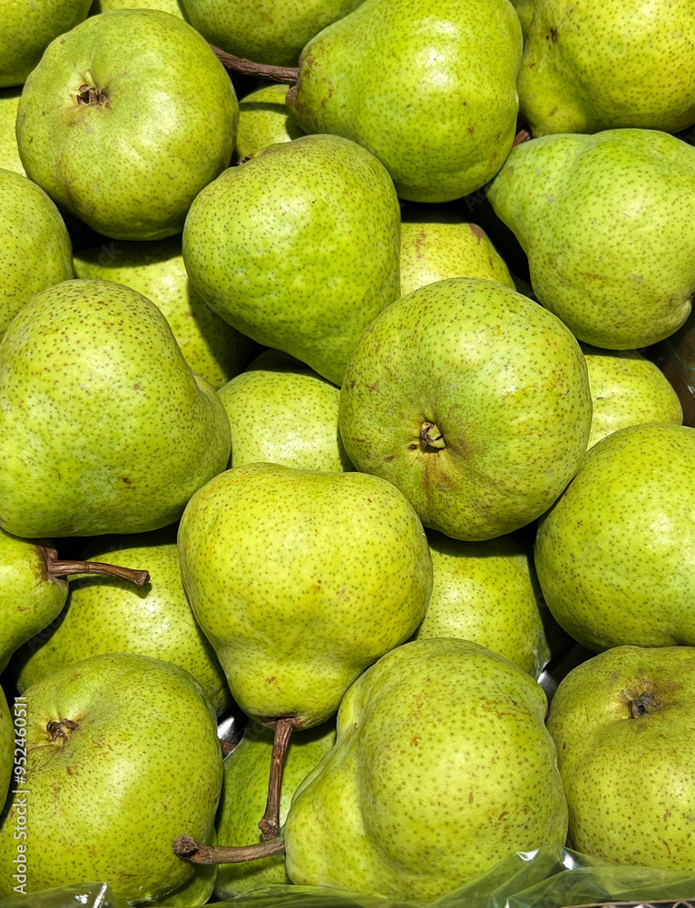 Many green pears .Close up vertical background Many green pears .Close up vertical background