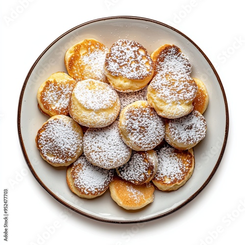 Homemade Dutch Poffertjes Pancakes with Powdered Sugar isolated on white background