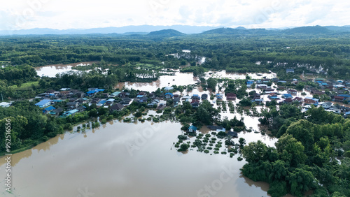 defaultThe aerial photograph shows the severe flooding in Nan Province on August 22, 2024. The image reveals entire residential areas submerged under murky floodwaters. photo