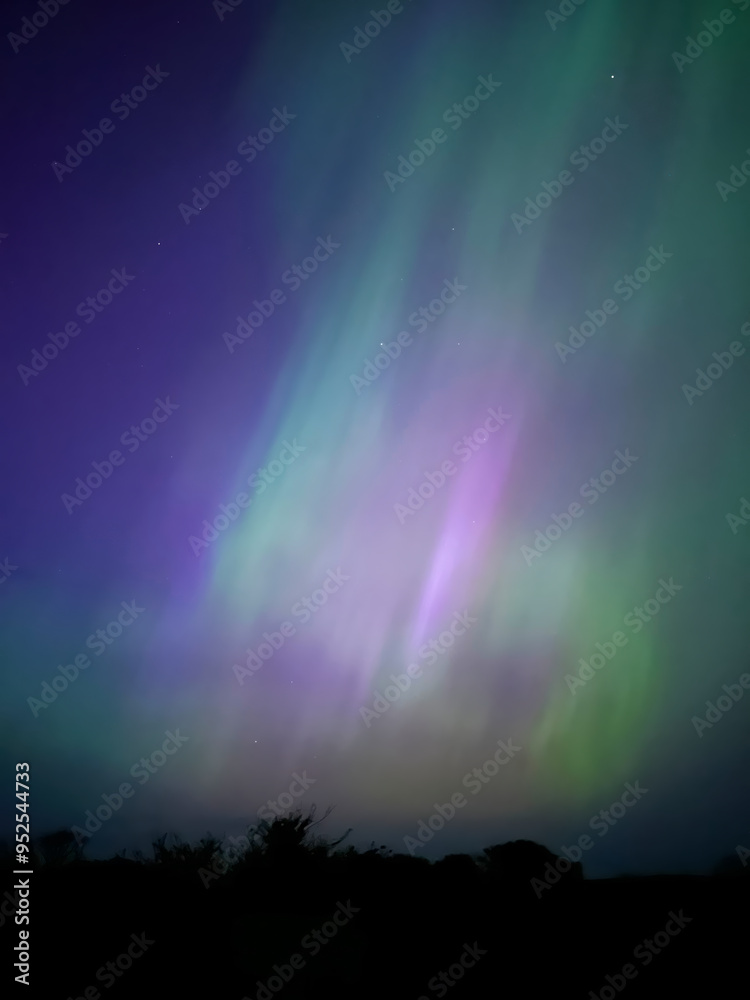 Gorgeous and rare extreme solar storm creating rare Northern Lights or Aurora Borealis in an amazing light show over Onchan on the Isle of Man Gorgeous and rare extreme solar storm creating rare Northern Lights or Aurora Borealis in an amazing light show over Onchan on the Isle of Man
