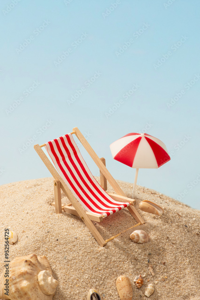 Rest. Miniature red beach chair on sand with shells Rest. Miniature red beach chair on sand with shells