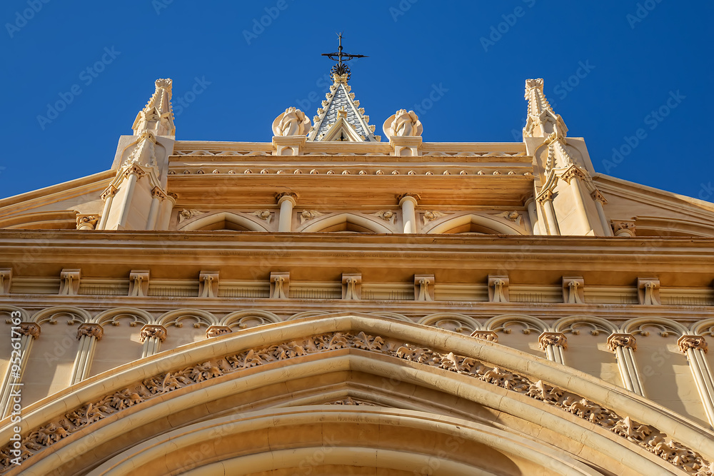 Obraz premium Sunset view of the Sacred Heart of Jesus Church (Iglesia del Sagrado Corazon de Jesus) is the only neo-Gothic work that has been built in the old town of Malaga, Costa del Sol, Andalusia, Spain.