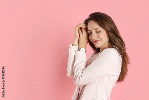 Beautiful woman in stylish white suit and watch on pink background, space for text