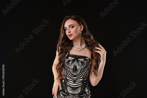 Portrait of beautiful woman on black background
