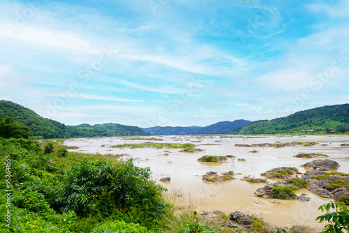 Landscape riverside of brown water eroded rocks and islets in mekong river at sangkhom district, Nong Khai province, Thailand. photo