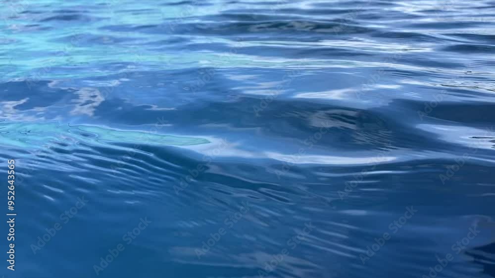 clear blue waters of a serene ocean. The video captures the gentle movement of the water's surface, showcasing the calm and peaceful ambiance of the sea. Perfect for backgrounds, nature themes clear blue waters of a serene ocean. The video captures the gentle movement of the water's surface, showcasing the calm and peaceful ambiance of the sea. Perfect for backgrounds, nature themes