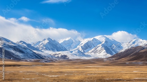 Snow-capped mountains under a clear blue sky winter weather photo