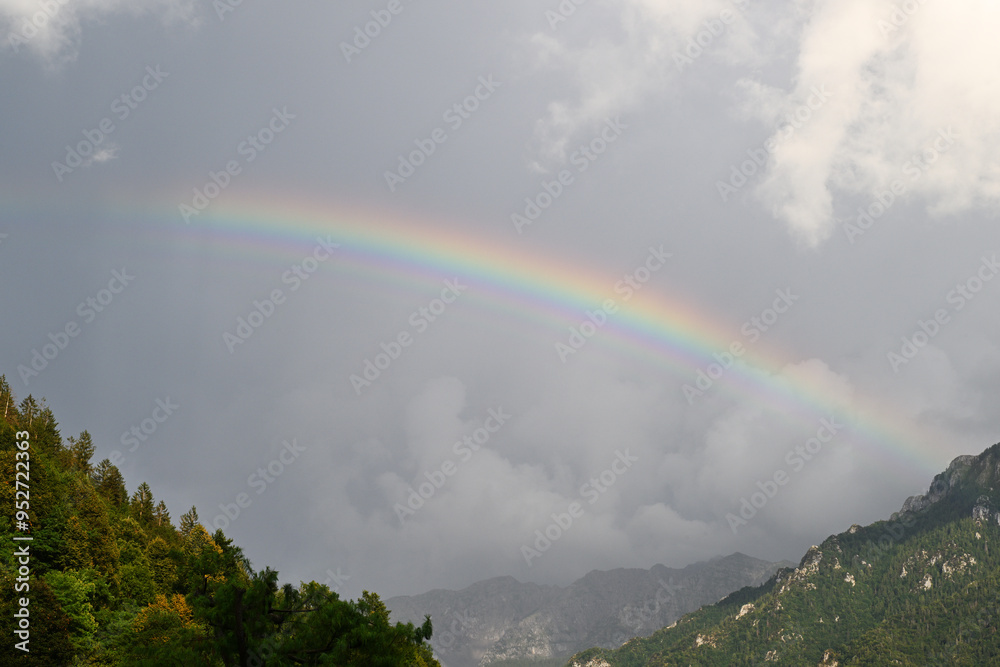 Panorama with rainbow over a mountains Panorama with rainbow over a mountains